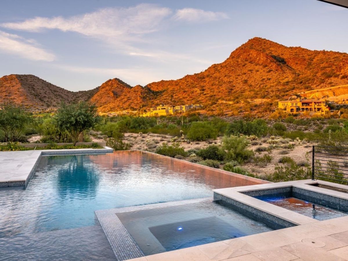 Luxury desert infinity-edge pool and spa with mountain sunset views